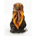 Yellow paisley silk scarf for women styled as a bohemian retro headband wrap - Orange