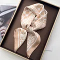 Elegant champagne and white polka dot silk square scarf displayed in a luxury gift box - Polka Dot Khaki
