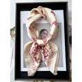 Off-white silk-like square scarf featuring red paisley patterns and floral prints - Rice Pink