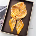 Polka dot silk scarf in vibrant yellow and orange tones, smooth texture flat lay - Polka Dot Yellow