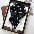 Elegant black and white polka dot silk square scarf displayed on a luxury brown tray - Black White Polka Dot White Wide Border Style (6)