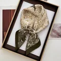 Detail of floral printed silk scarf with gold flower patterns and deep green borders - Large Square / Gold Brown Vintage Line (21)