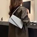 Chic silver sequin underarm bag with minimalist rectangular flap for stylish women - Silver