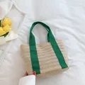 Handmade straw tote bag in natural beige with vibrant green canvas handles for summer - Green