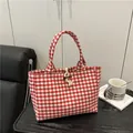 Red and white gingham canvas tote bag with rustic toggle closure and woven loop detail - Red