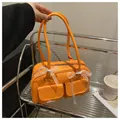 Sac à épaule orange en similicuir avec nœuds en dentelle blanche et deux poches - Orange