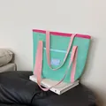 Large mesh beach tote bag in mint green and pink for outdoor summer activities - Green
