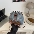 Fashion drawstring bucket bag in blue denim and brown leather with metal buckles - Blue Without Charm