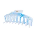 Detailed macro view of large blue and white marble pattern hair claw clip with golden spring - Blue White Marble