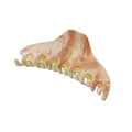 Macro detail of large acetate hair claw clip featuring elegant beige and brown marble texture - Beige and Brown Marble