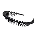 Detail of matte black wavy headband featuring non-slip comb teeth on white background - Black