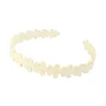 Detailed view of the white flower headband with non-slip matte daisy floral design - Cream