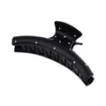 Detailed view of the glossy black hair claw clip with white polka dots for secure styling - Crescent Shape / Black Crescent Moon Style