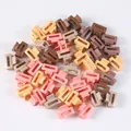Nahaufnahme verschiedener matter Haarklammern in Pastellfarben und Erdtönen für Kinder - Beutelverpackung / Rechteckiger Stil (2#)(A0258) / 50-teiliges Set (2.5 cm) / bunt