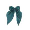 Detail of the oversized dark teal satin bow hair clip with smooth glossy ribbon texture - Dark Green