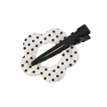 Detailed view of translucent white flower hair clip with black polka dots and metal duckbill - Spotted Flower White