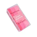 Close-up of 32pcs pink elastic hair ties set in a clear box with super elasticity label - Pink