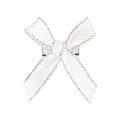 Détail d'une pince à cheveux nœud blanc avec des bords scintillants en paillettes argent - Blanc Argent