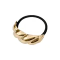 Detailansicht eines elastischen Haargummis mit großem goldenem Metallknoten-Element - Breiter Twist