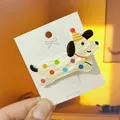 Detail of cute puppy hair clip with colorful polka dots and striped birthday hat decoration - Multicolor Spotted Dog Duckbill Clip