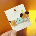 Detailed view of dog acrylic hair clip with pearl texture and cherry pattern on a card - Cherry Pattern Dog Duckbill Clip