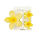Detailed set of three yellow frangipani hair claws on a white display card packaging - One Large And Two Small / Lemon Yellow