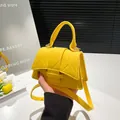 Bright yellow quilted felt mini handbag with adjustable crossbody strap and top handle - Yellow