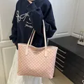 Pink monogram tote bag with large capacity for daily commute shown on model - Pink