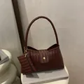 Dark brown woven leather shoulder bag with matching mini pouch and gold buckle detail - Brown
