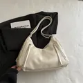 Minimalist beige soft faux leather half-moon shoulder bag with dual front zipper accents - No Pendant / White