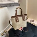 Bolso tipo cubo vintage de lona y cuero marrón con asa superior y correa de hombro - Estilo Vintage Beige Marrón / Blanco y Marrón