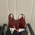 Retro deep red shoulder bag in glossy synthetic leather with silver rivet strap detail - Red