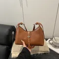 Vintage brown PU leather tote bag featuring silver rivets and adjustable shoulder strap - Brown
