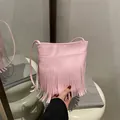 Pink bohemian tassel crossbody bag in soft synthetic leather with fringe detail - Pink