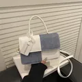 Fashionable blue and white patchwork crossbody handbag with stylish logo tag - White
