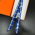 Detail view of navy geometric twilly scarf with vertical stripes and orange gift box - Blue Geometric Style (3#)
