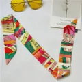 Colorful geometric pattern silk scarf twilly with yellow sunglasses and postcard - Orange