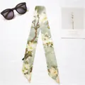 Elegant grey-green silk twilly scarf with yellow magnolia print and sleek sunglasses - Magnolia Blossoms (Grey Green)