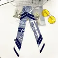 Blue and white silk-feel skinny scarf with geometric patterns for bags and hair - Chain Blue