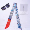 Narrow silk scarf with colorful hot air balloon print in orange and royal blue - Architecture Red
