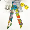 Silk-like skinny scarf featuring leopard and tropical plant patterns for hair or bags - Leopard Yellow