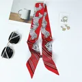 Detail of red zebra print silk scarf with satin texture and decorative wash label - 100x6cm / Red