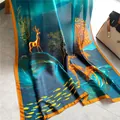 Artistic silk scarf with gold deer and fish pattern in deep teal and orange accents - Lucky Deer