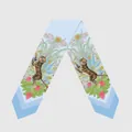 Detailed pattern of light blue silk scarf featuring forest tigers and red flowers - Light Blue