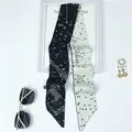 Detail of Aries tarot silk scarf featuring celestial patterns and Le Bélier text - Aries