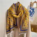 Detail of star pattern jacquard scarf with long fringe on beige wool coat - Blue-Yellow