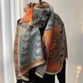 Detail of warm wool blend scarf with carriage print, orange and blue tassels - 180x65cm / Lake Blue Orange