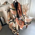Detail of vintage carriage print shawl draped on chair with fringe edge texture - Beige Orange