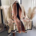 Detail of vintage floral pattern on thick beige shawl with elegant black tassels - Beige Orange