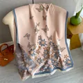 Detailed close-up of butterfly floral printed shawl with delicate white fringe accents - Pink